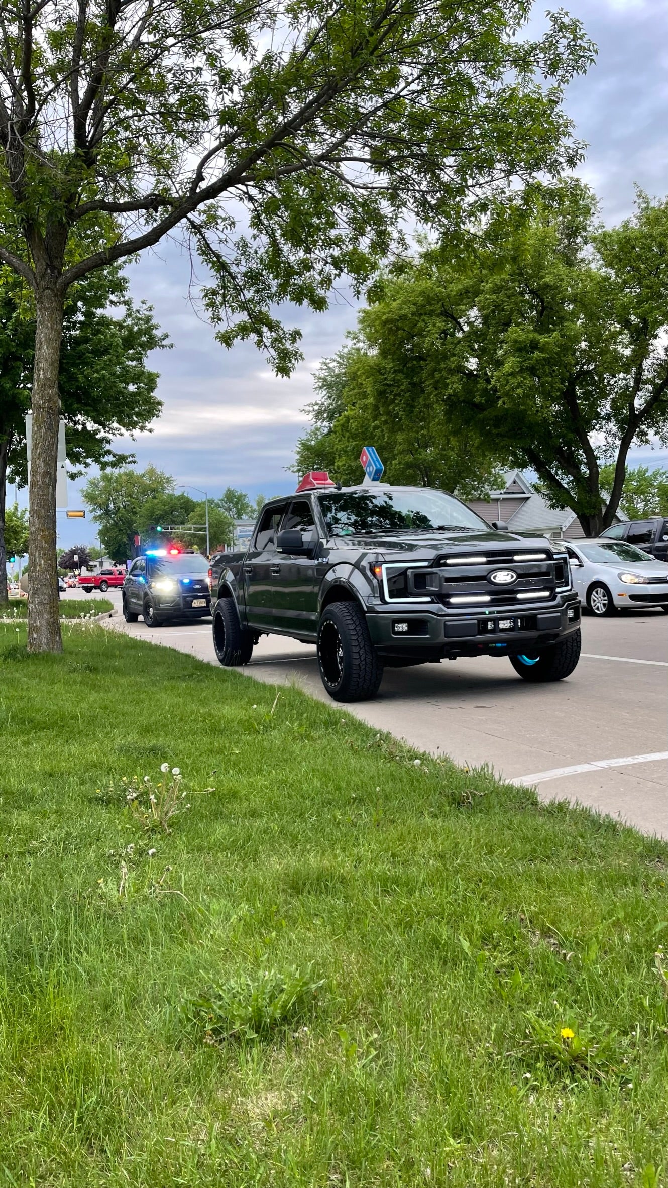 grey ford f150 with 4 bar grill lights 